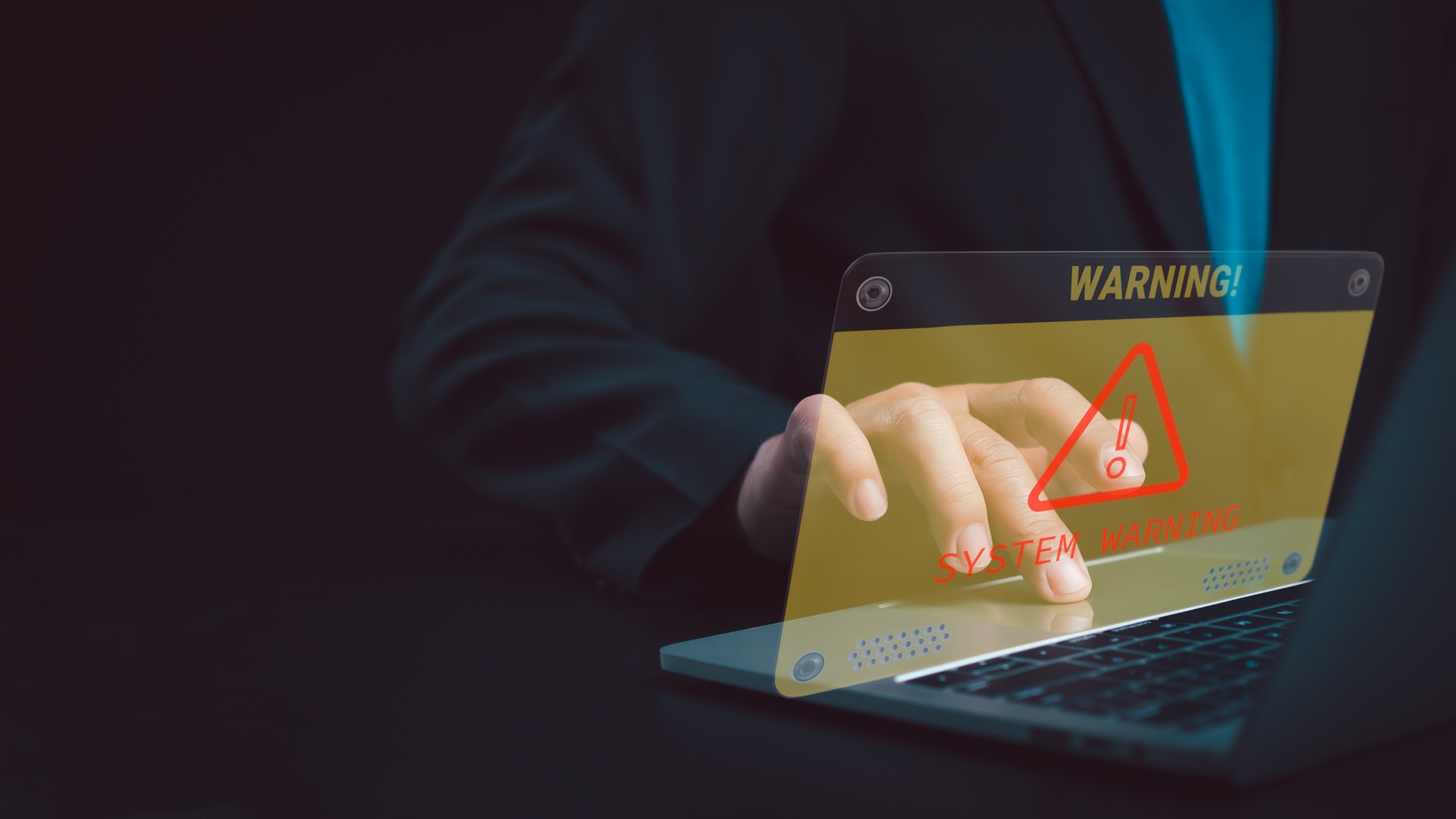 Security professional discovering a system warning alert during an intrusion test on a corporate laptop