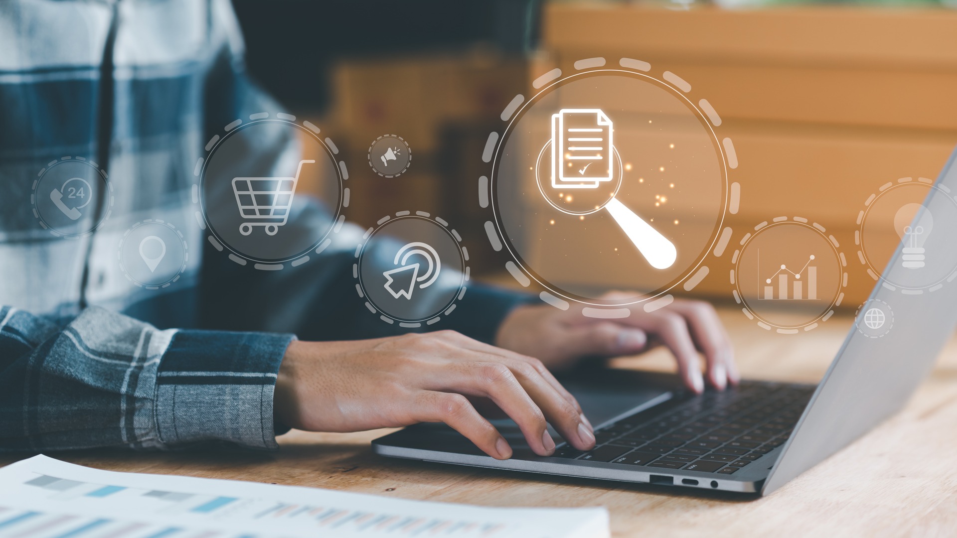 Australian IT professional reviewing a SOC 2 report on a laptop with audit and compliance icons